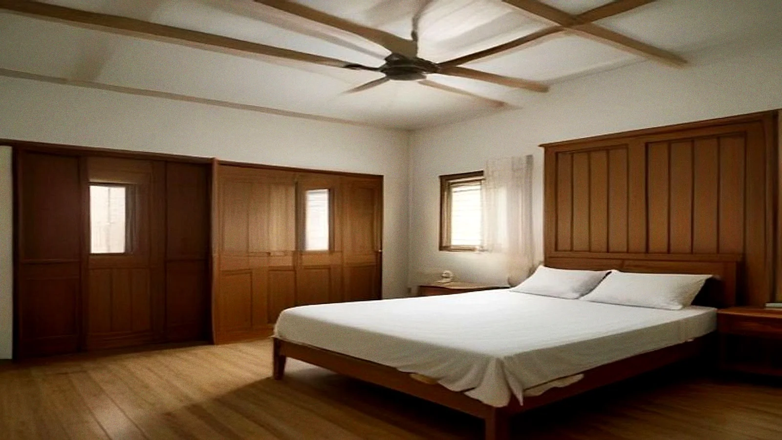 A bedroom in the afternoon, a wall of teak wardrobe doors along one side and a ceiling fan turning above the bed.